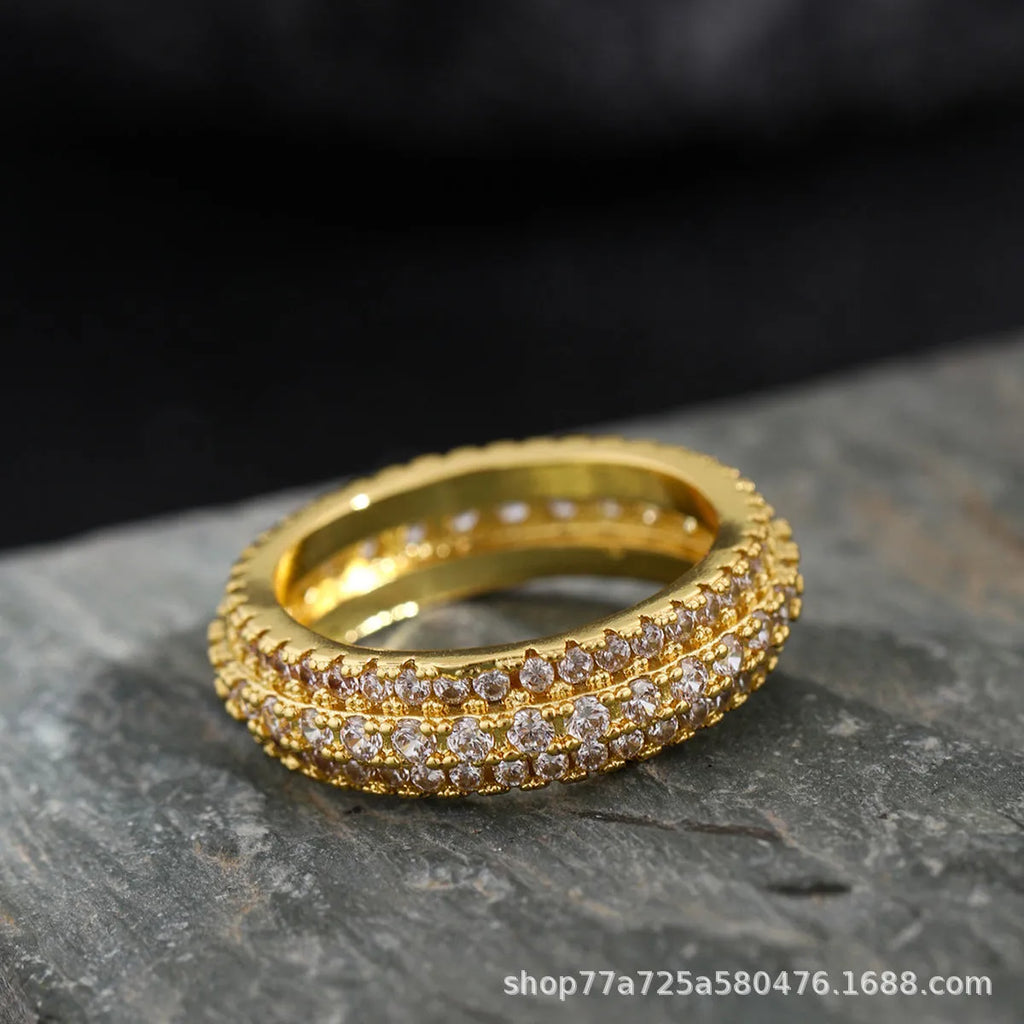 Geometric triangular copper engagement ring with zircon stone inlay, shown in white gold plating.