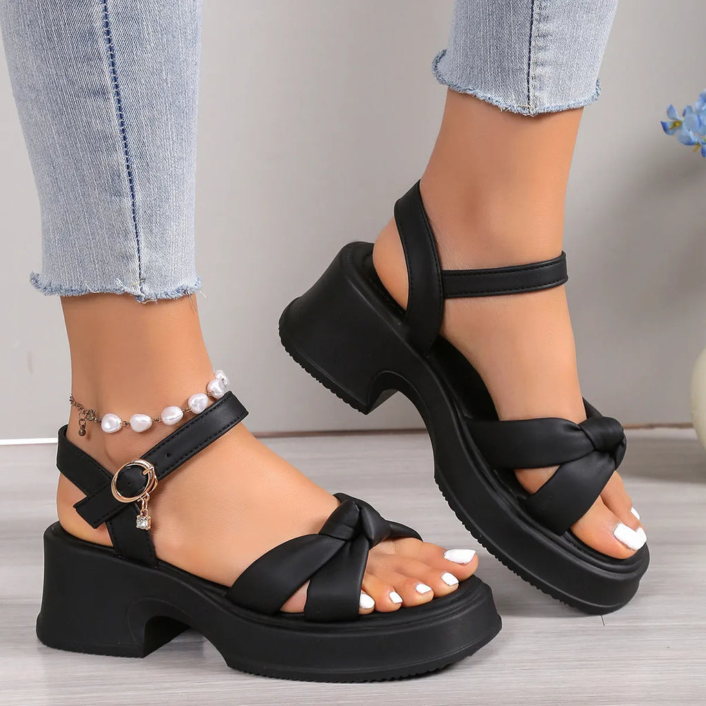 Black women's high heel slippers with thick rubber sole and round toe.