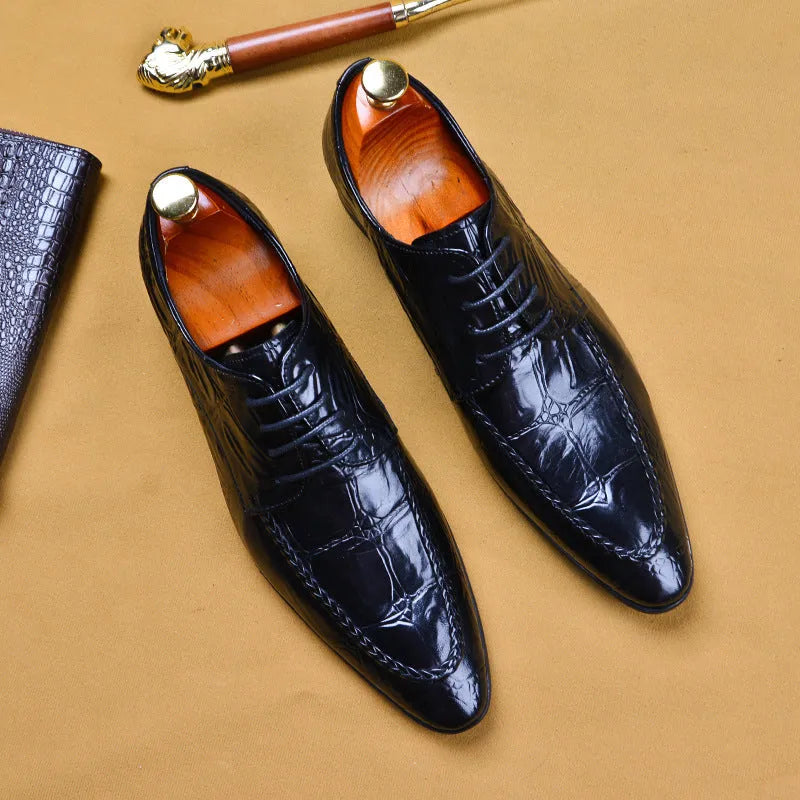 Men's brown leather shoes with alligator pattern texture and a silver horse bit buckle on the front.