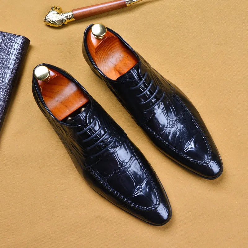 Men's brown leather shoes with alligator pattern texture and a silver horse bit buckle on the front.