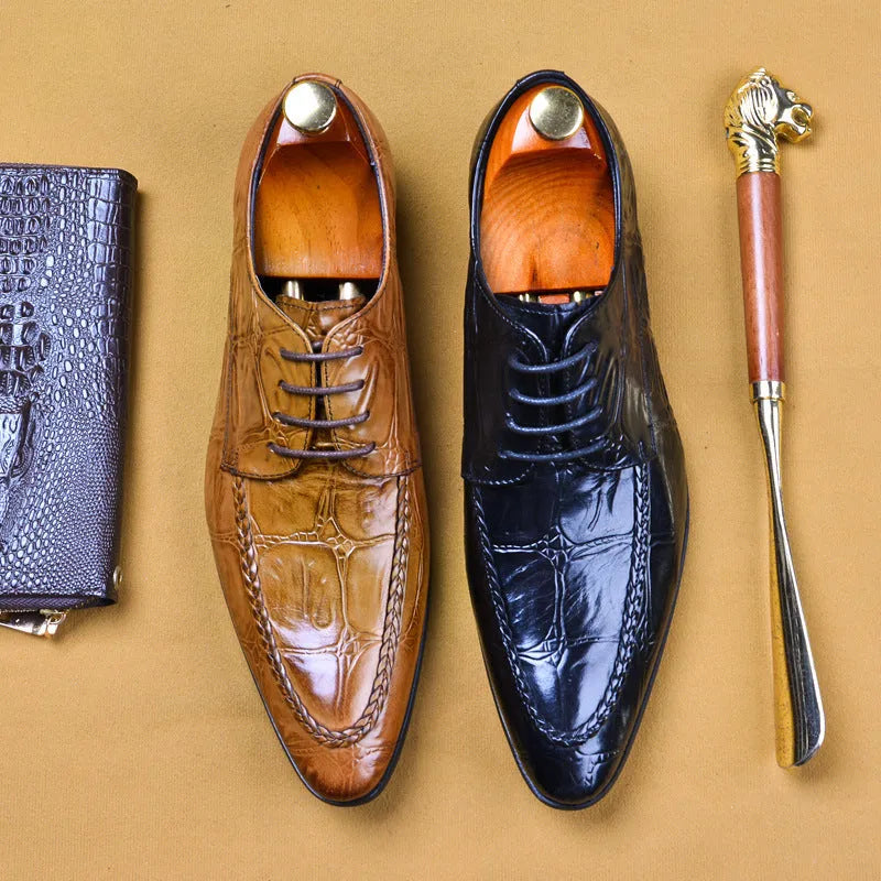 Men's brown leather shoes with alligator pattern texture and a silver horse bit buckle on the front.