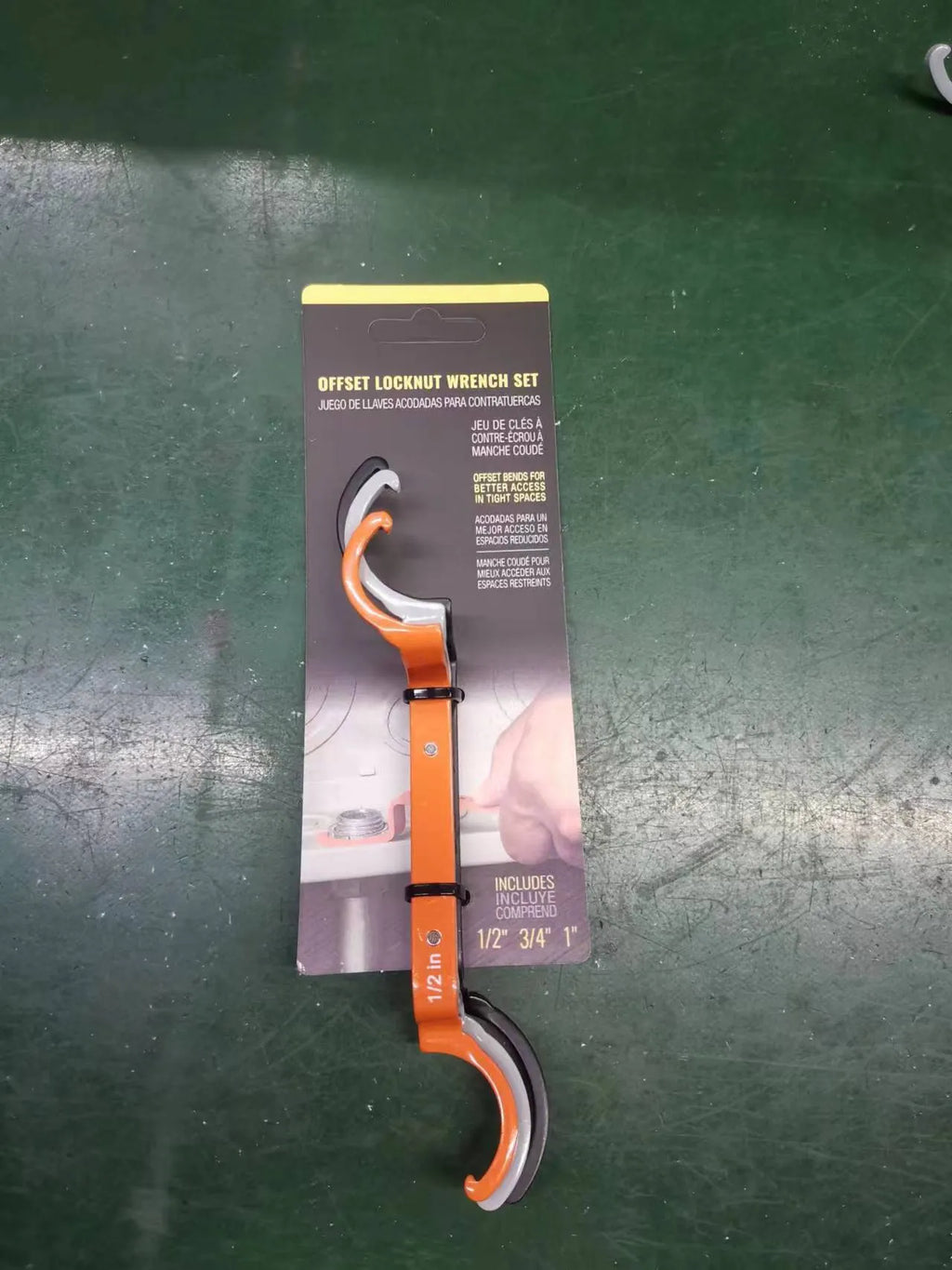 Orange, grey, and black crescent wrenches with magnetic suction lock in a three-piece tool kit.