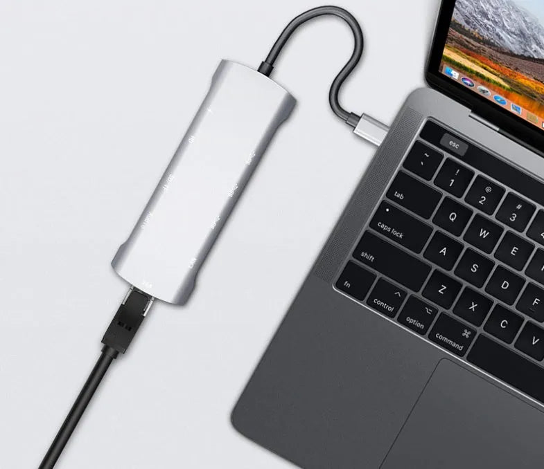 Grey USB C docking station with HDMI, VGA, and USB 3.0 ports for laptop connectivity