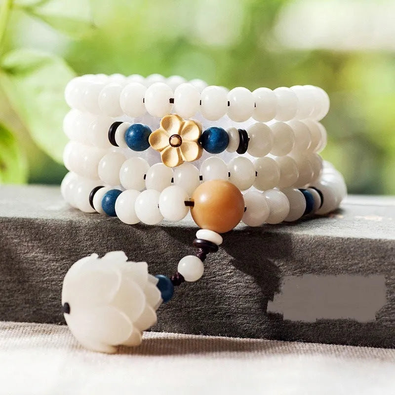 White jade Bodhi bead bracelet with 6x8mm beads in various decorative styles