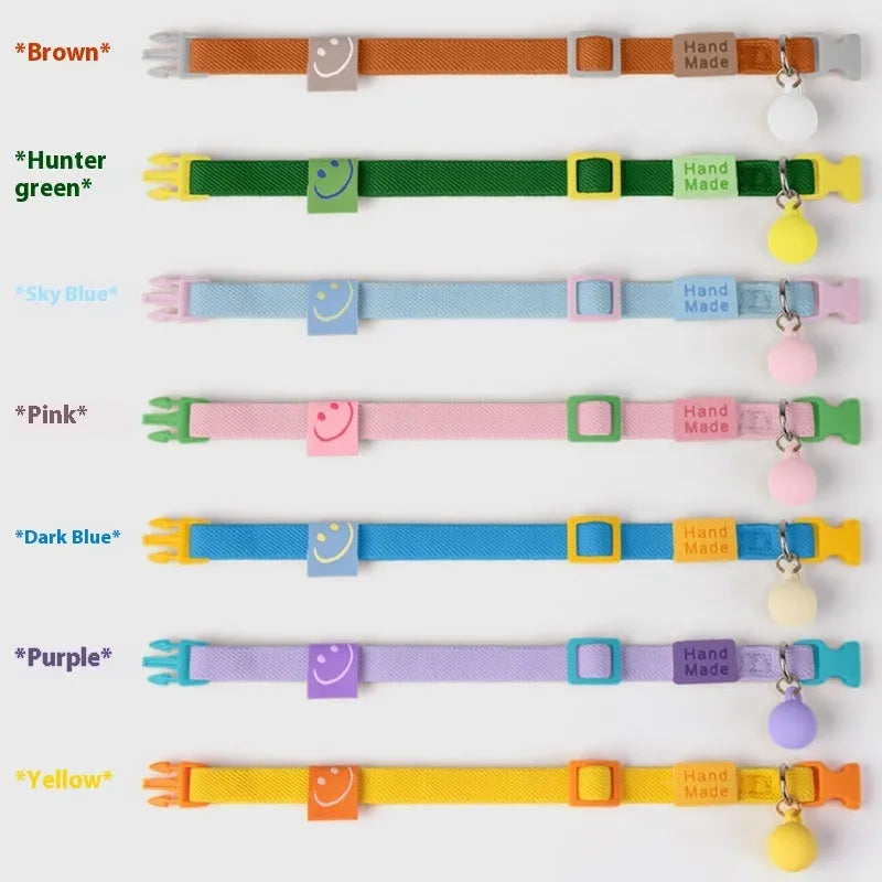 Small dog wearing adjustable polyester pet collar with monochrome pattern in one of seven available colours