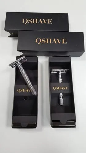 Chrome double-edged safety razor with metal handle, one blade, and a storage box.