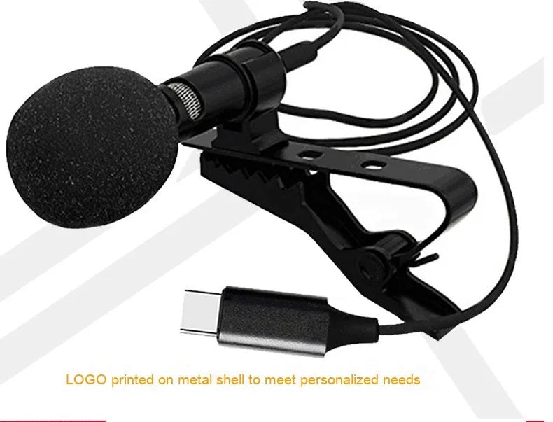 Black USB-C lavalier microphone with digital DAC chip, metal clip, sponge cover, and storage bags.