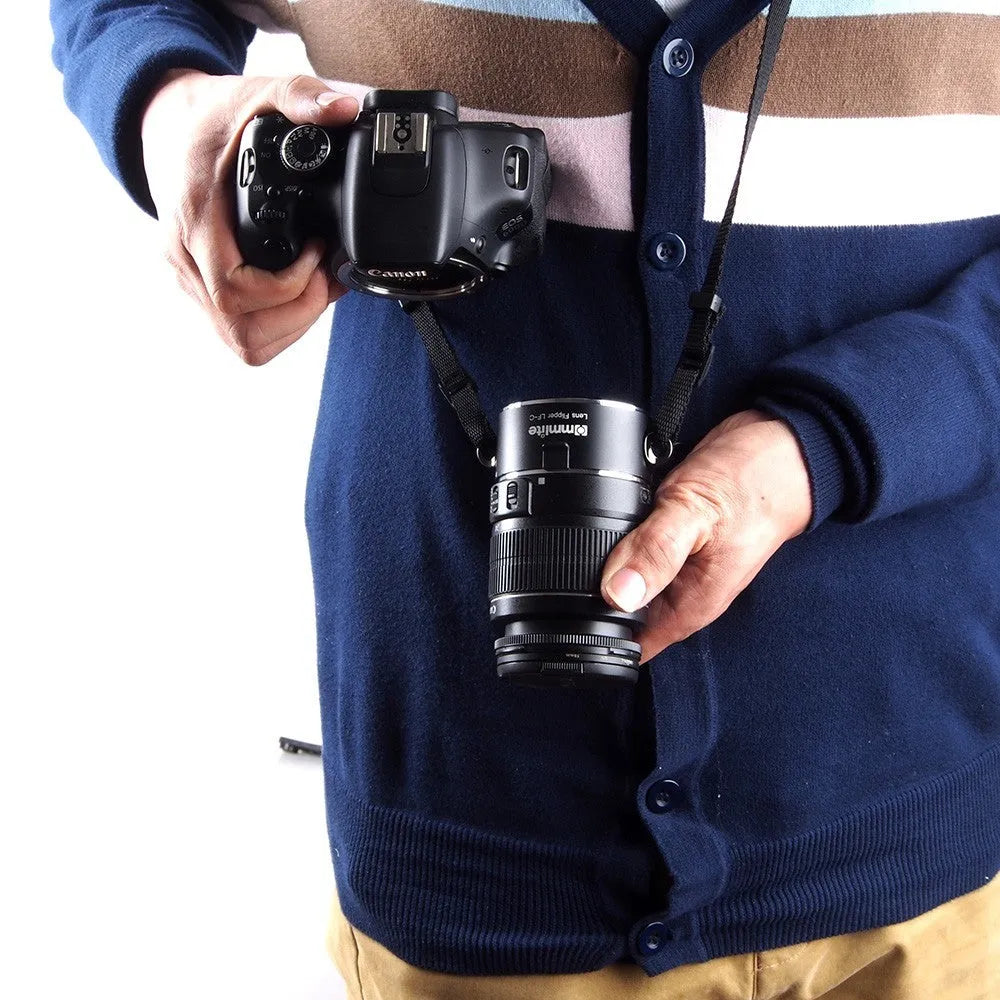Aluminium camera lens flipper holder for Nikon F-mount with cotton shoulder strap.