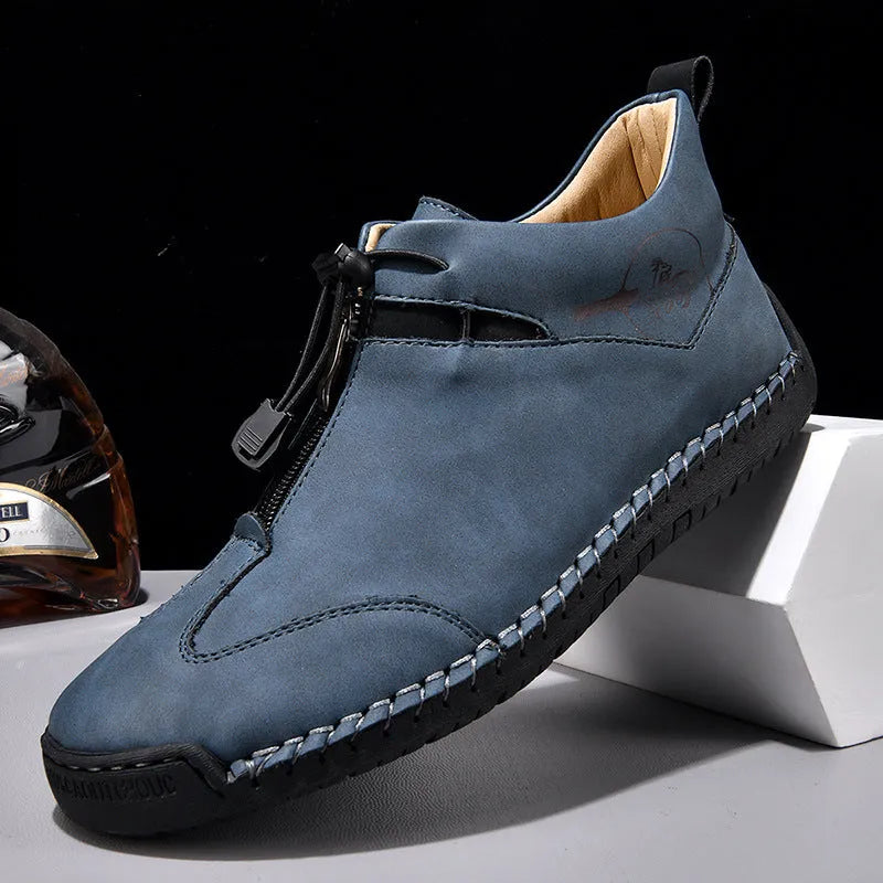 Men's black casual leather shoes with a round toe, rubber sole, and mid-height heel.