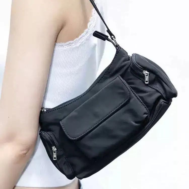 Black women's shoulder bag with double pockets and side line detail
