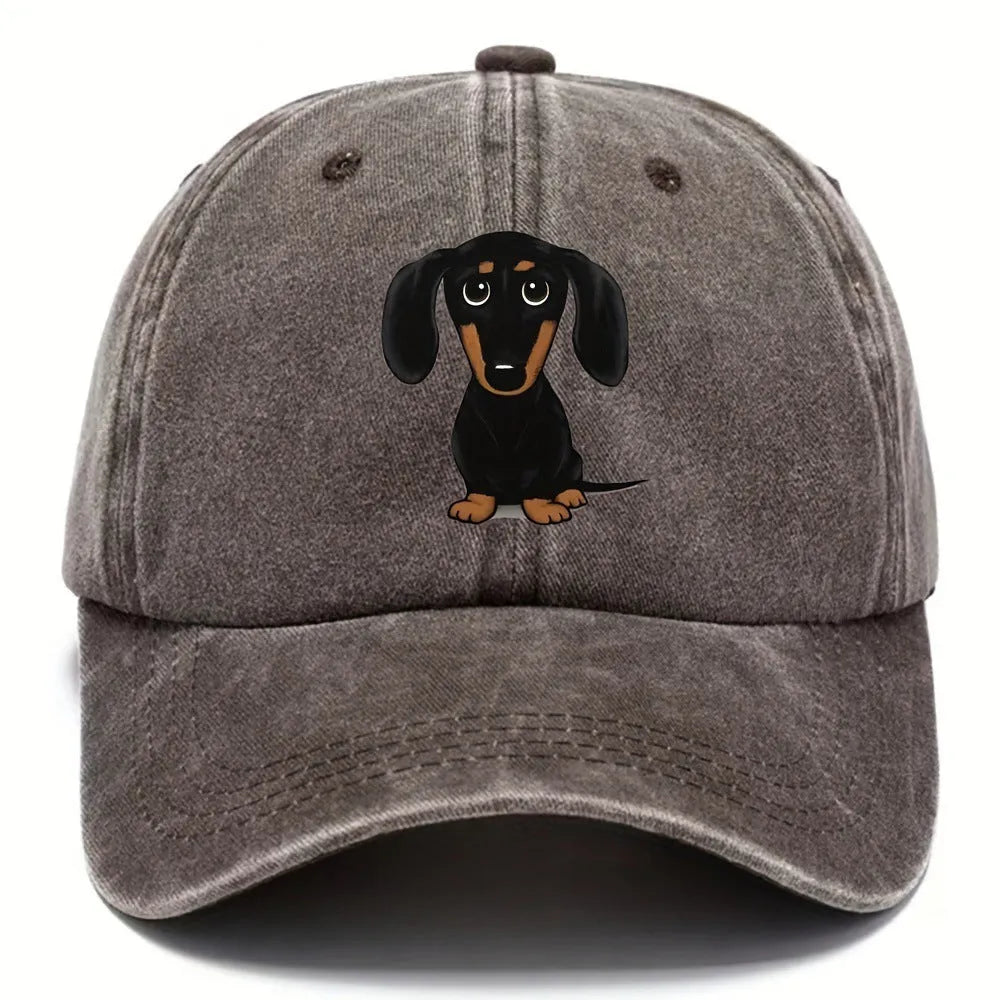 Retro washed blue cotton baseball cap with a machine-embroidered brown Dachshund dog graphic on the front.