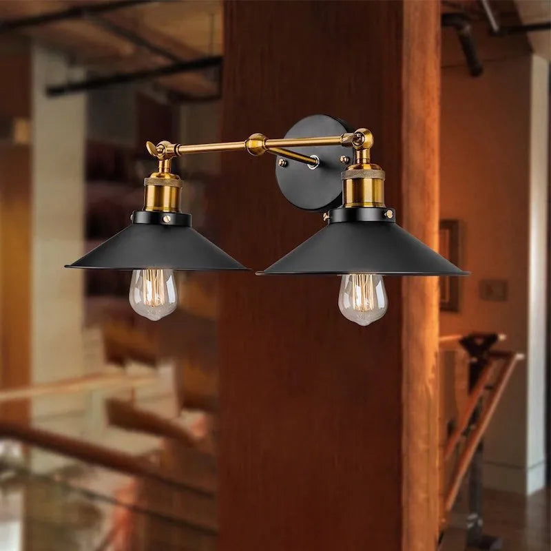 Black iron industrial-style wall lamp with two adjustable heads in a retro design