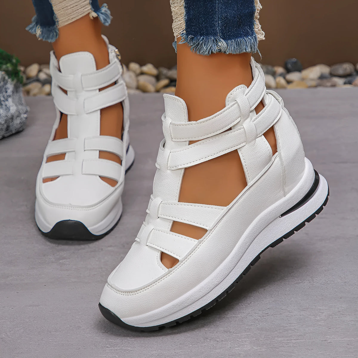 Women's black close-toed hollow-out platform sandals with Velcro strap on a white background.