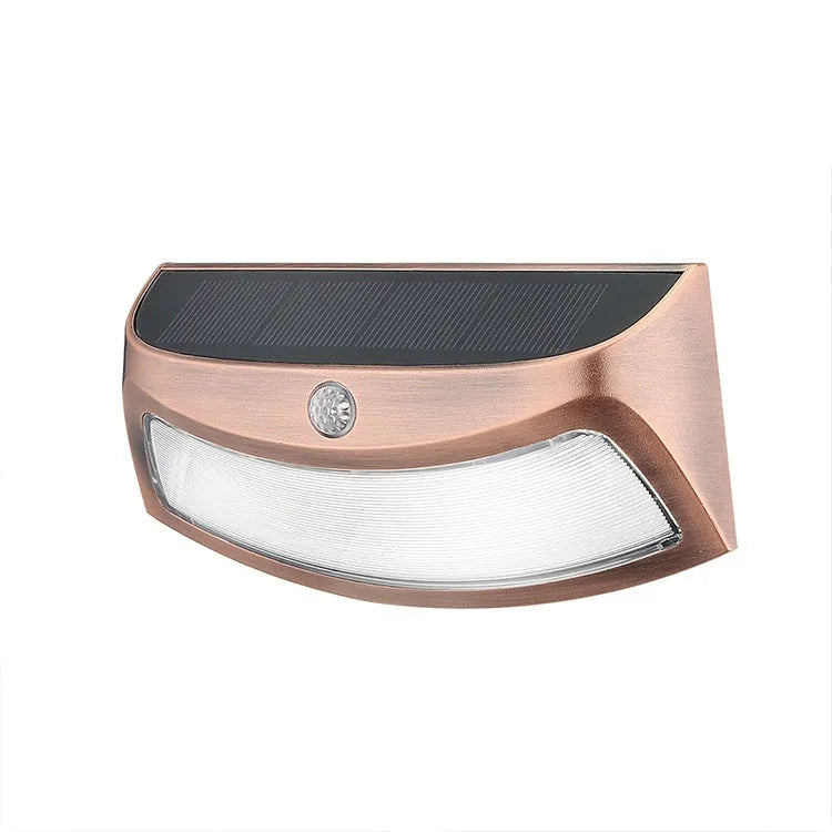 Solar outdoor wall lamp with smiling face design for garden lighting