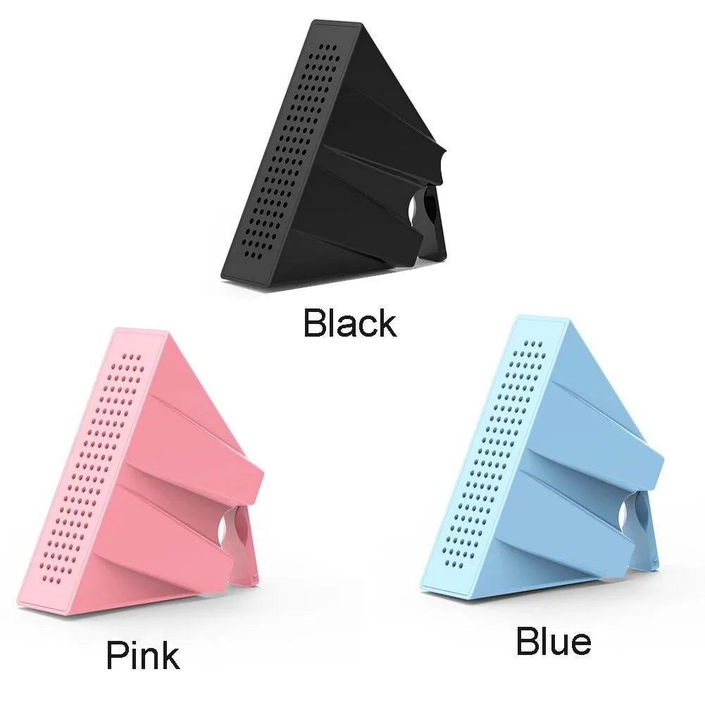 A portable black ABS mobile phone amplifier bracket holding an iPhone to boost sound for desktop use.