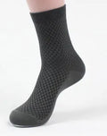 Men's black bamboo fibre socks with small square pattern on ankle