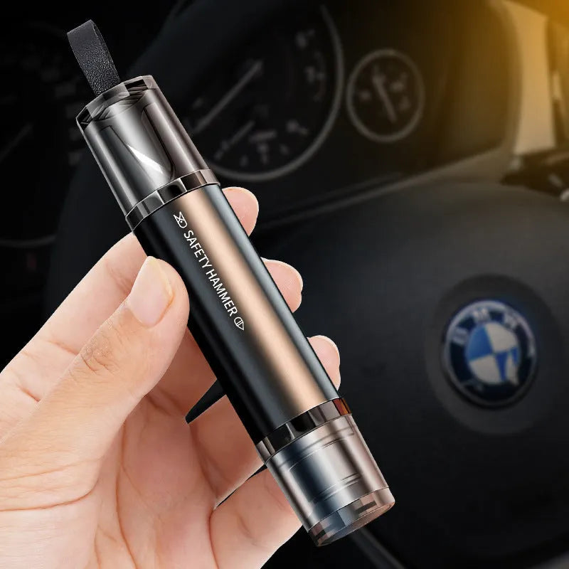 Black and red car safety hammer with tungsten steel window breaker tip and hidden seat belt cutter