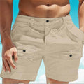 Men's khaki linen shorts with elastic waistband and button pockets on a mannequin.