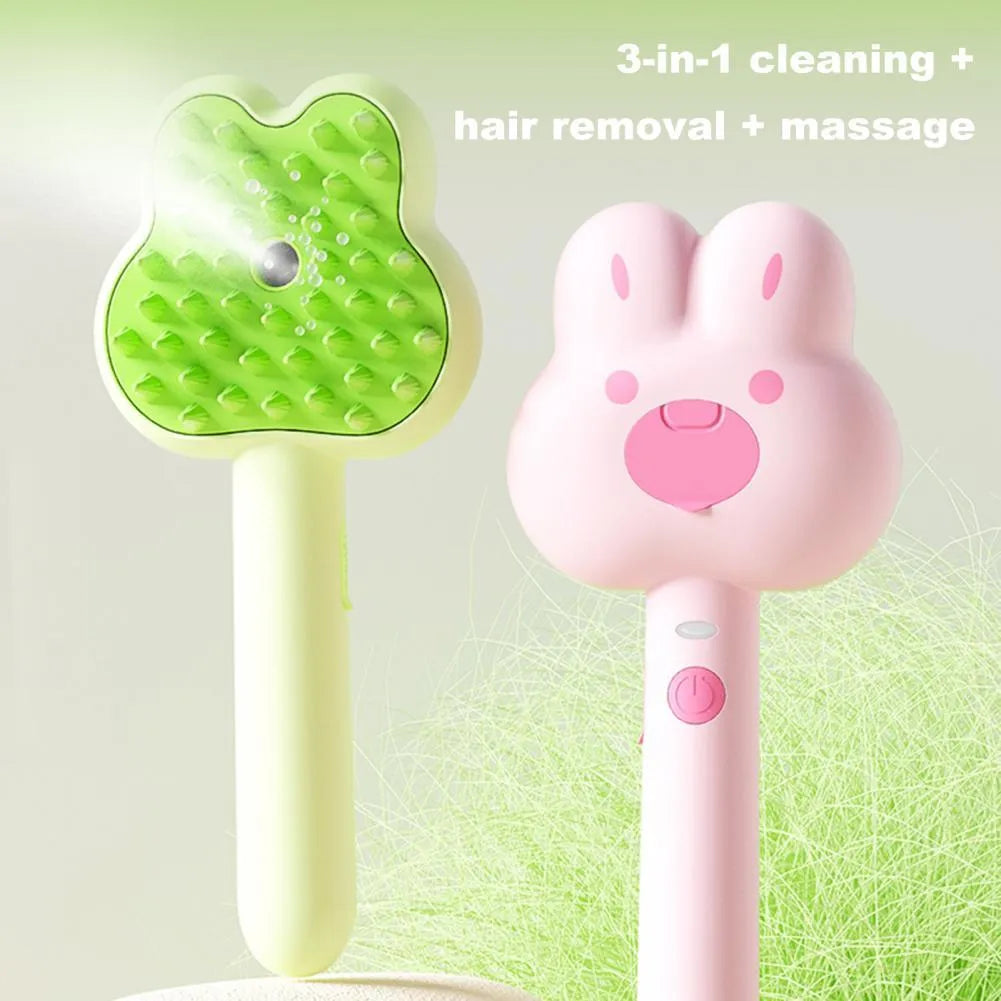 Rechargeable pink cartoon-design steam brush comb for grooming cats and dogs on a table.