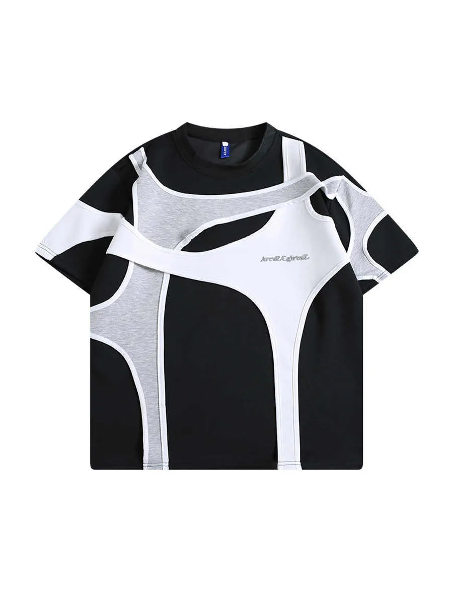 Man wearing a black loose fit short sleeve t-shirt with double stitching and padded shoulders.