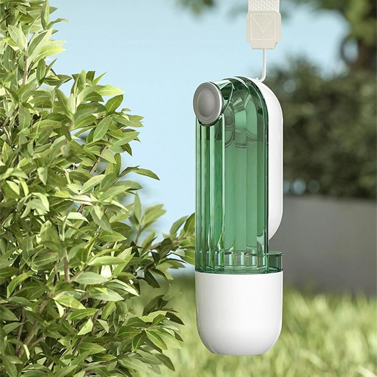 Folding dog water bottle with food dispenser in beige or green for outdoor pet activities