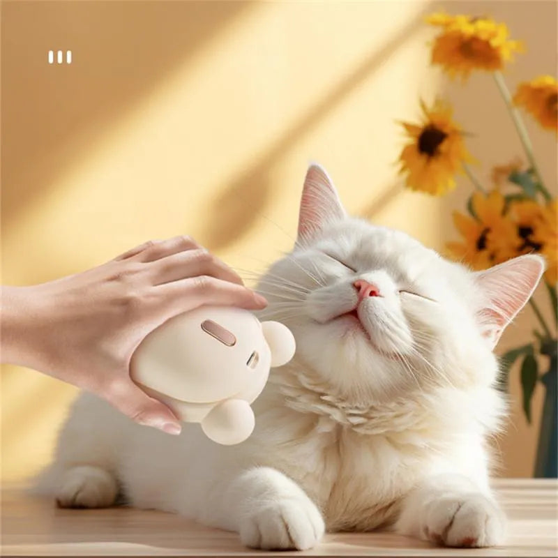 Pink and yellow rechargeable 3-in-1 pet grooming comb with spray function and massage teeth.