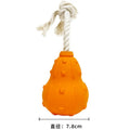 Natural rubber dog toy with longer strap, hollow treat-dispensing centre, for small medium breed dogs.