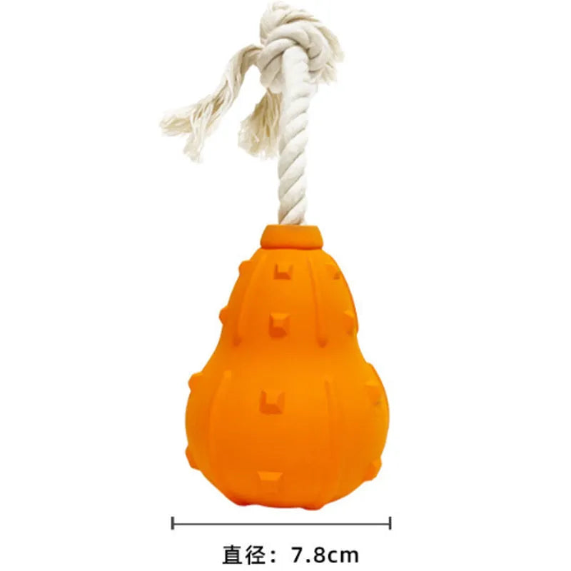 Natural rubber dog toy with longer strap, hollow treat-dispensing centre, for small medium breed dogs.