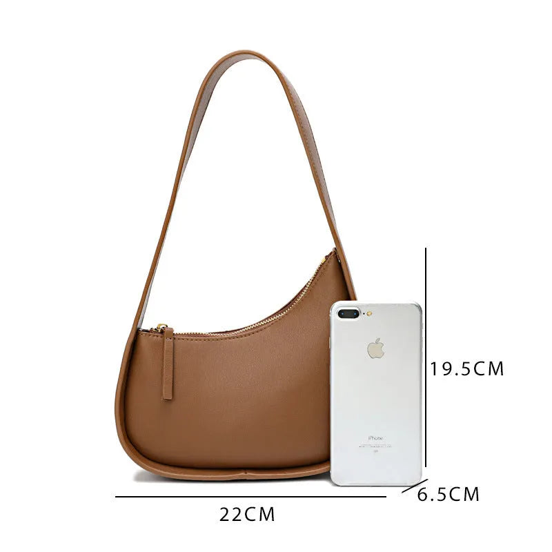 Half moon shaped leather women's shoulder bag with wide strap