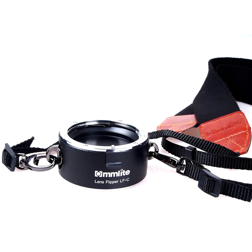 Aluminium camera lens flipper holder for Nikon F-mount with cotton shoulder strap.