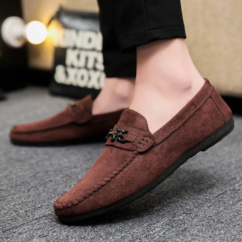 Men's black slip-on loafers with round toe and low heel on a white background