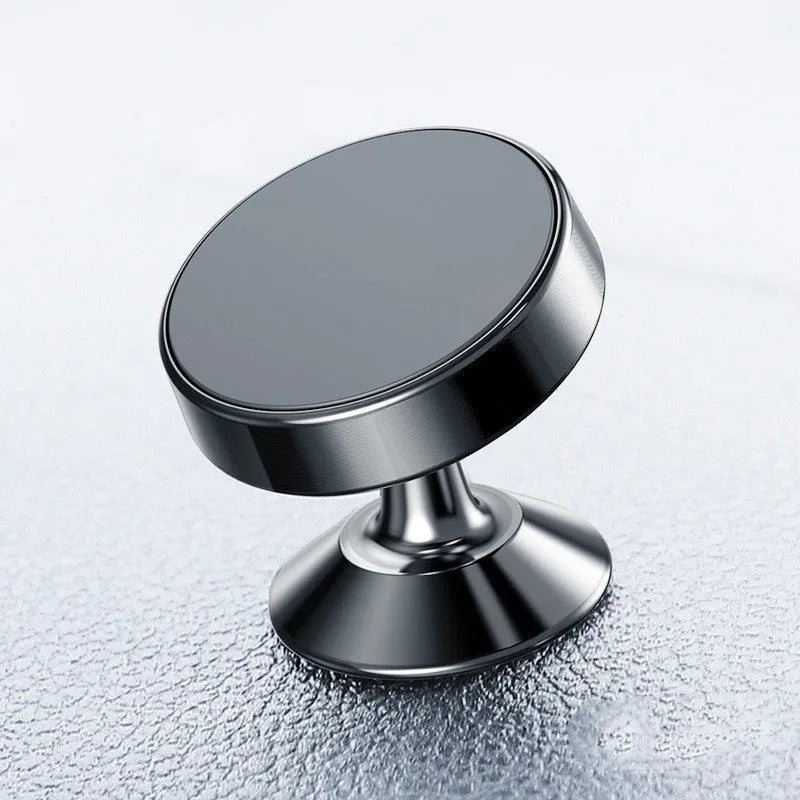 Black magnetic car phone holder with flexible arm mounted on a car air vent.