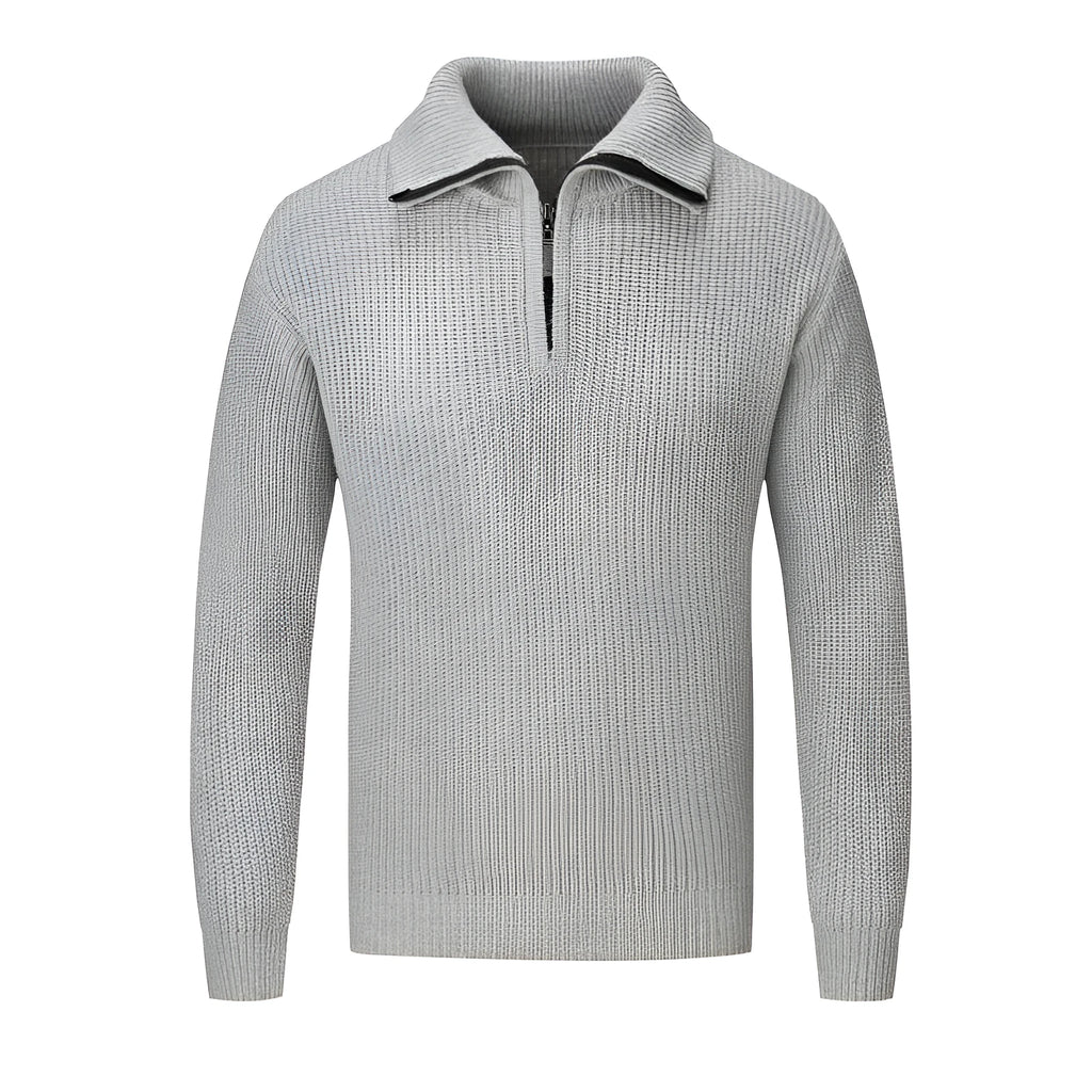 A man's loose-fitting slim pullover jumper in a solid colour, shown in a casual setting.
