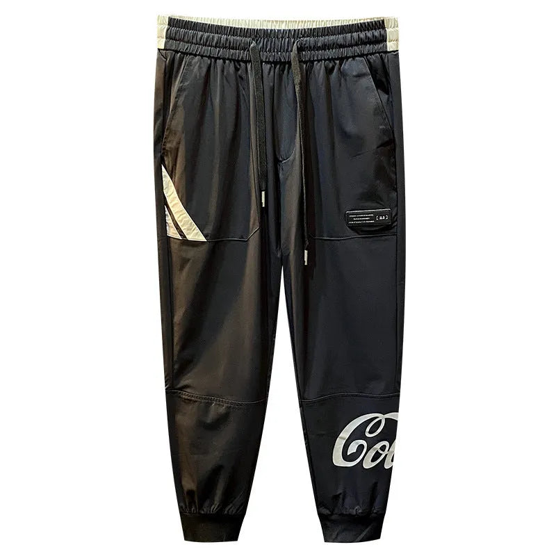 Black ultra-thin ice silk ankle banded cropped trousers for men displayed flat