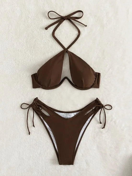 Women's solid colour halter bikini swimsuit with backless briefs in black, blue, or brown.