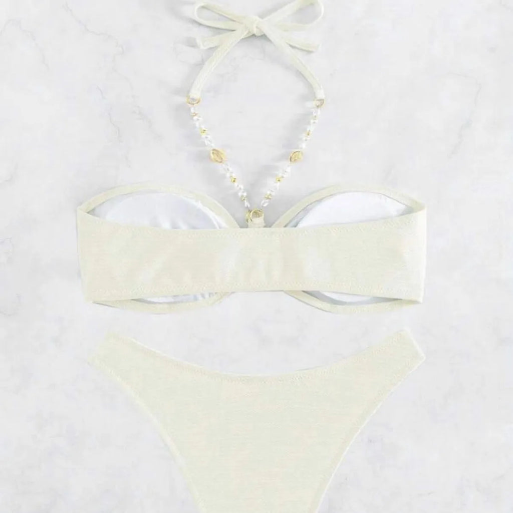Women's pure colour halter neck bikini set on a hanger, shown in creamy-white.