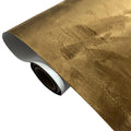 Roll of self-adhesive leather suede in beige colour showing texture and adhesive backing.