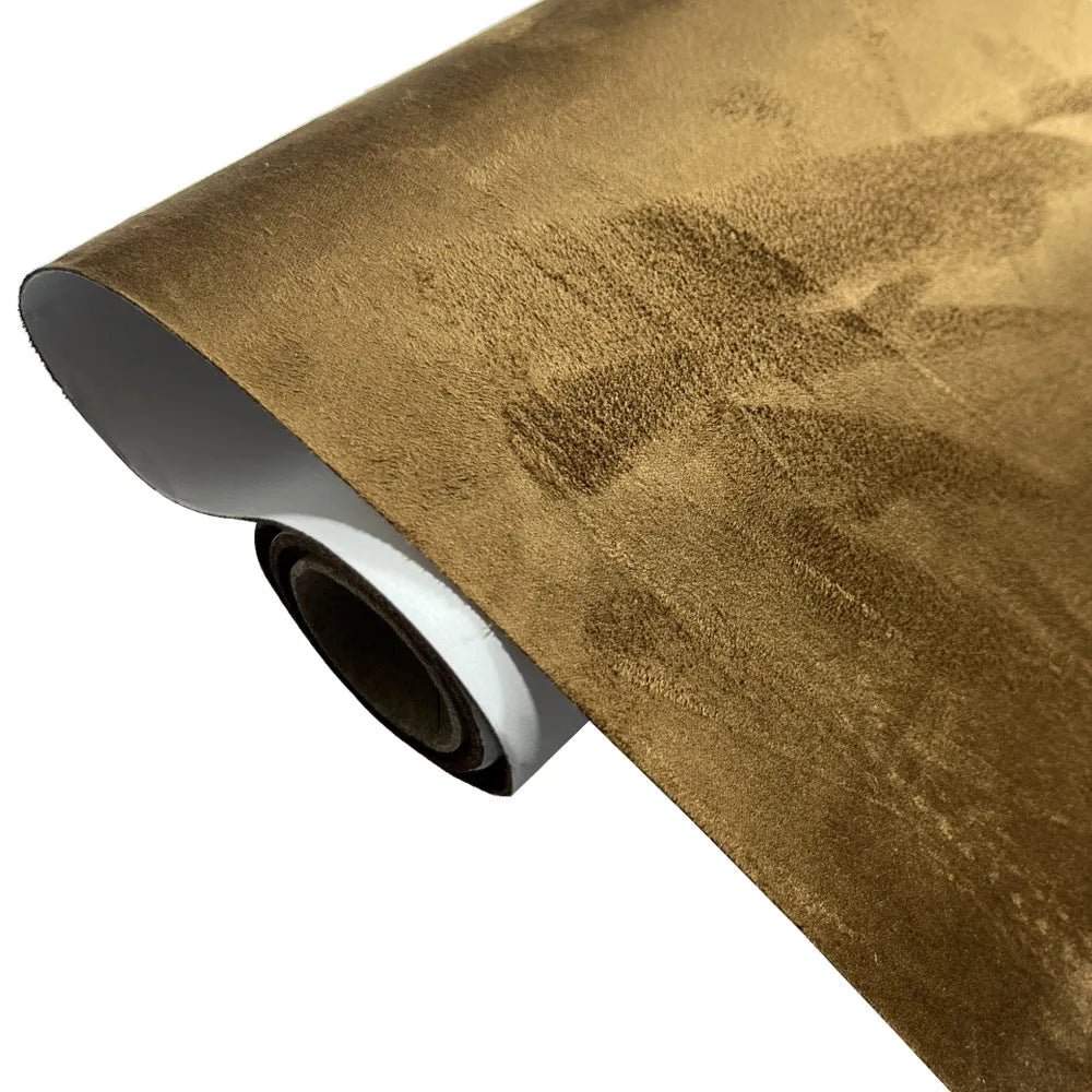 Roll of self-adhesive leather suede in beige colour showing texture and adhesive backing.