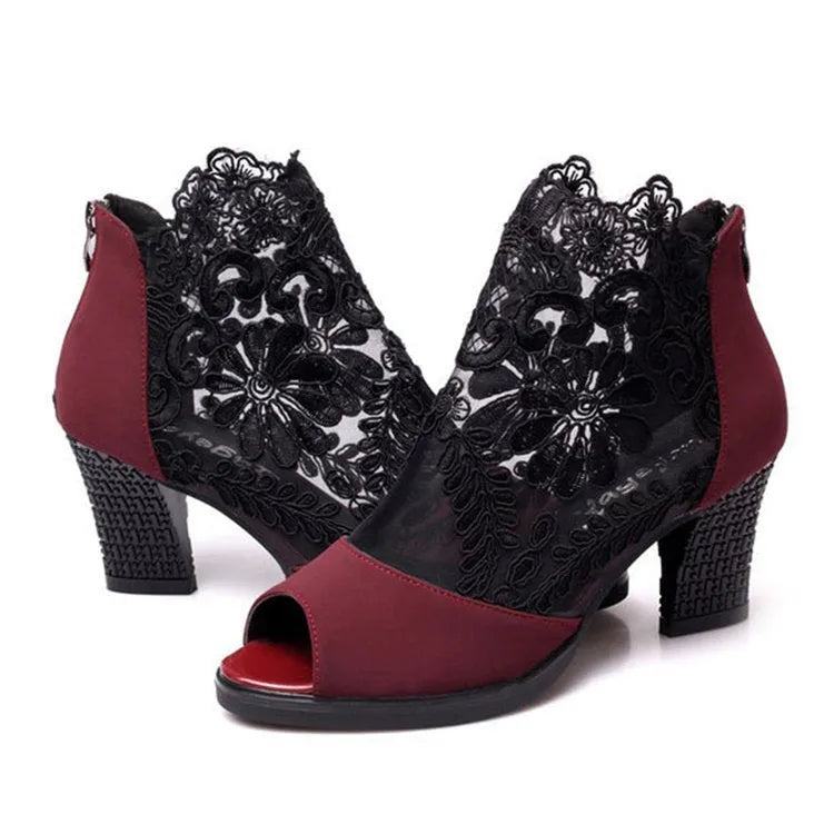 Black women's gladiator sandals with flower lace pattern and square heel on rubber outsole