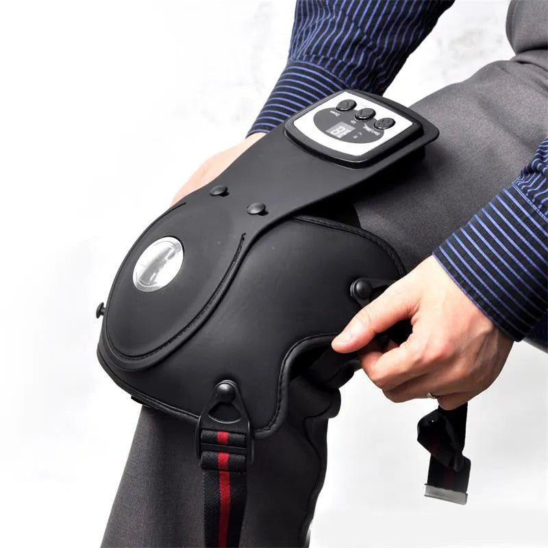 Knee and shoulder infrared heat massager with control unit, knee pads, and shoulder pads on a table