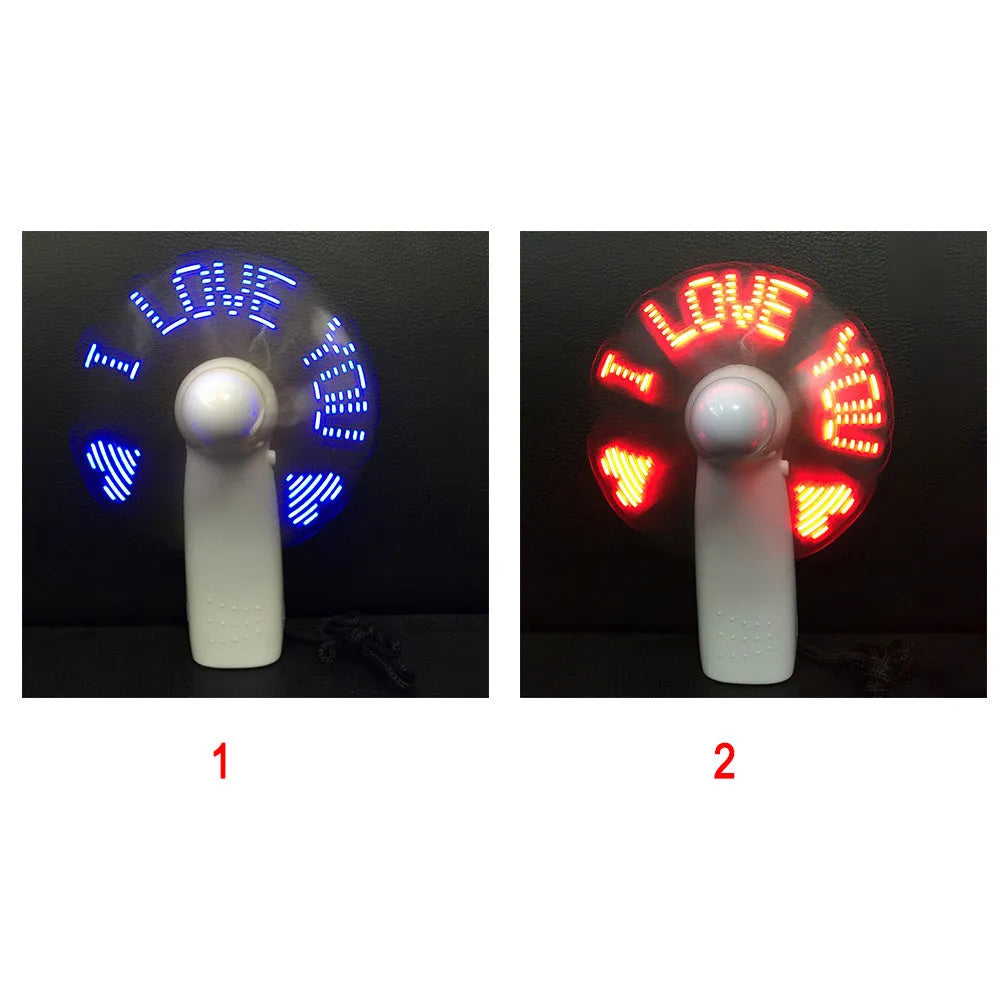 White handheld mini fan with a flashing blue and red LED 'I Love You' heart pattern on the front.