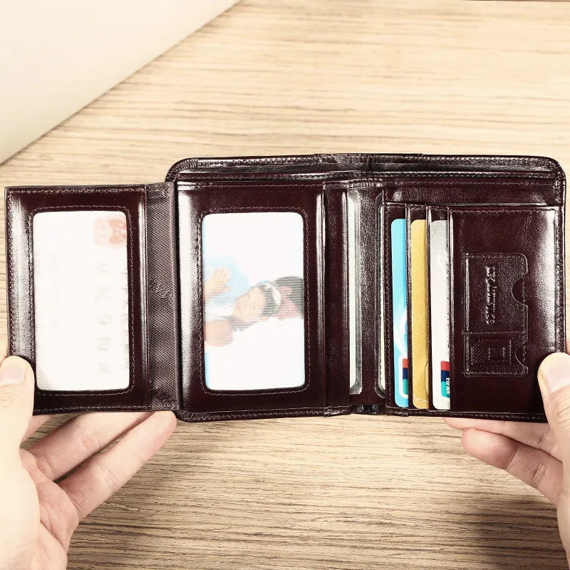 Men's leather organiser wallet open to show internal compartments including card slots and a zipped coin pocket.