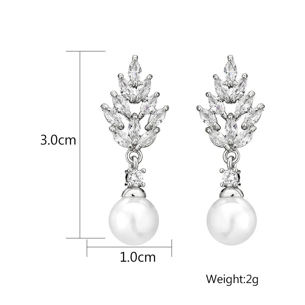 Geometric drop earrings with pearl and micro inlaid zircon, available in gold, platinum, and rose gold plating.
