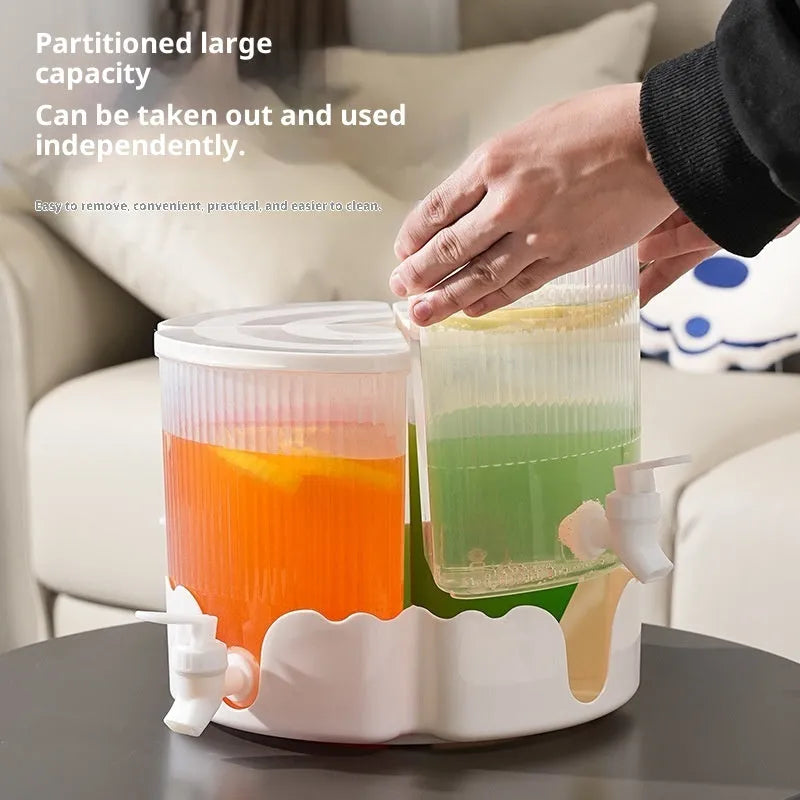 Rotating refrigerator water jug with faucet and four compartments in glacier pattern for cold drinks.