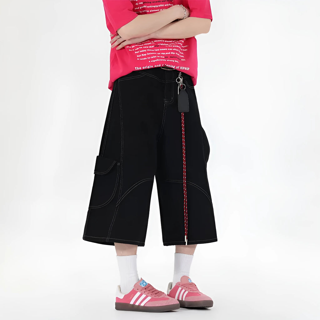 Retro denim workwear shorts with multiple pockets and wide leg cropped design in black colour