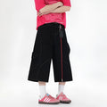 Retro denim workwear shorts with multiple pockets and wide leg cropped design in black colour