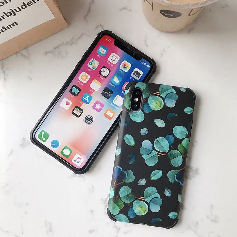 Black silicone iPhone case with a detailed raised leaf pattern design on the back.