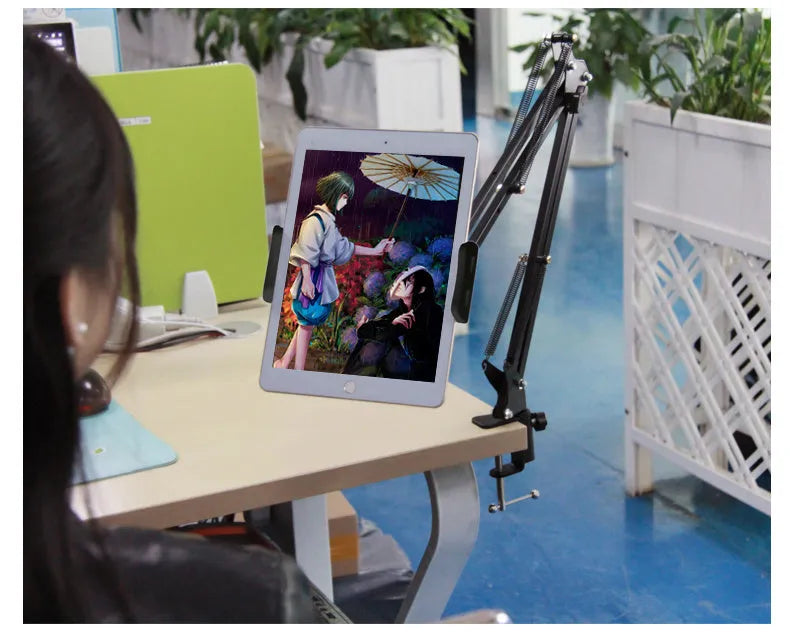 Adjustable black phone tablet stand holding mobile device at eye level