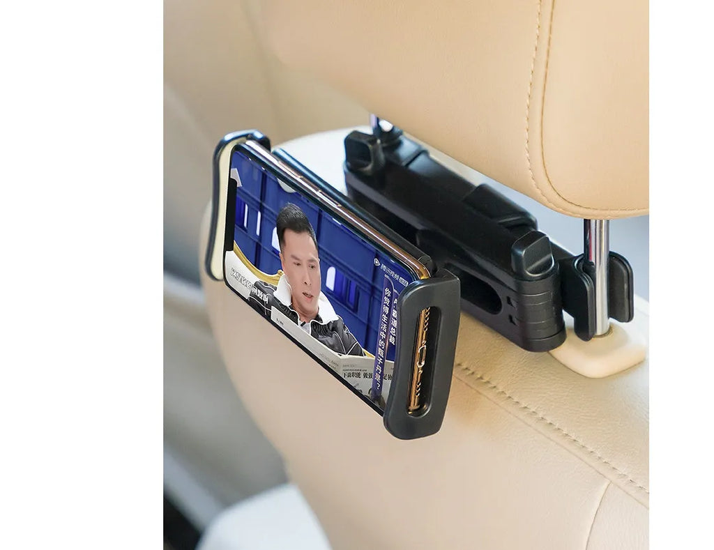 Black universal car phone holder mounted on a rear car seat, holding a tablet for navigation.