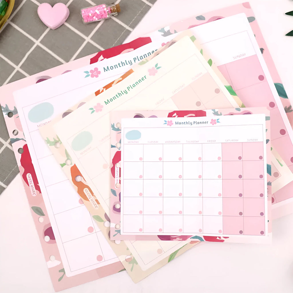 Handbook loose-leaf refill with floral monthly plan sheets in fold-out A7 design